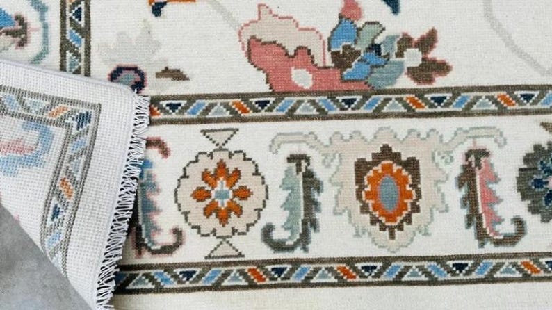 Hand-Knotted Ivory Oushak Rug: Pastel Floral Wool Carpet