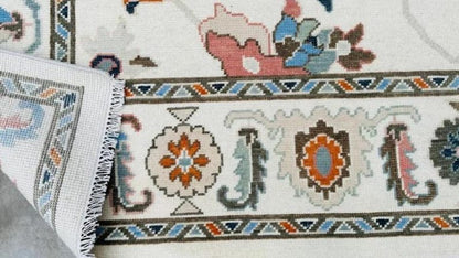 Hand-Knotted Ivory Oushak Rug: Pastel Floral Wool Carpet
