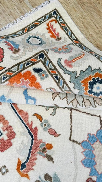 Hand-Knotted Ivory Oushak Rug: Pastel Floral Wool Carpet