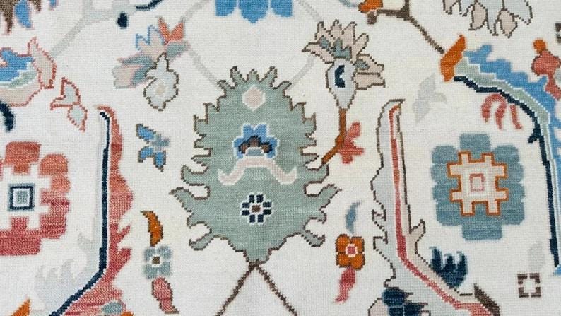 Hand-Knotted Ivory Oushak Rug: Pastel Floral Wool Carpet