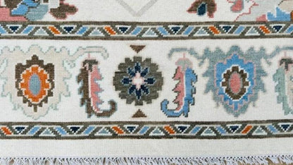 Hand-Knotted Ivory Oushak Rug: Pastel Floral Wool Carpet