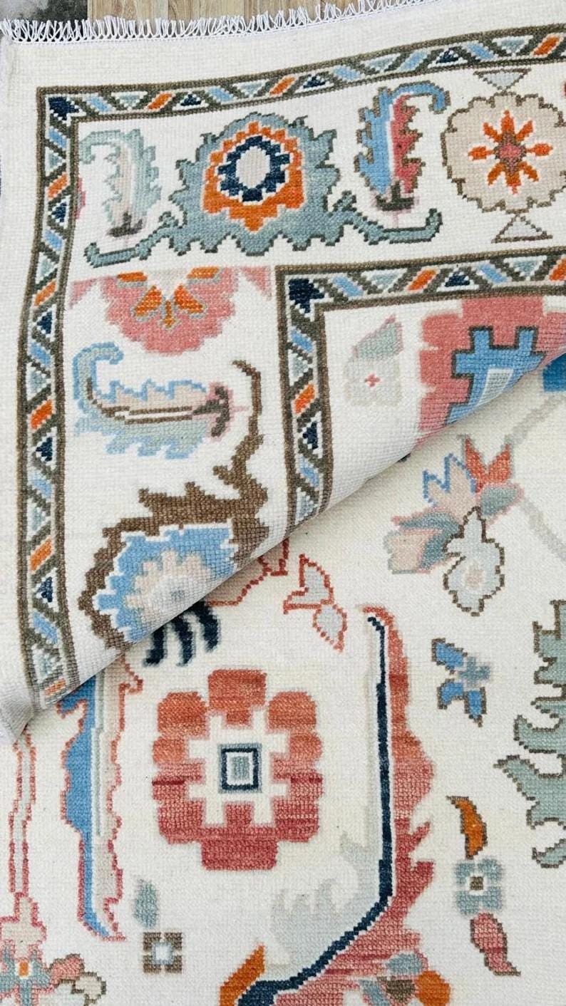 Hand-Knotted Ivory Oushak Rug: Pastel Floral Wool Carpet