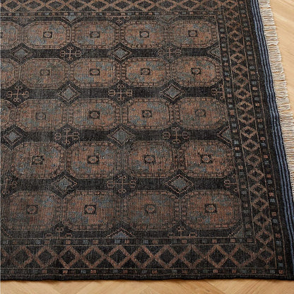 Patterned rug with geometric design on a wooden floor