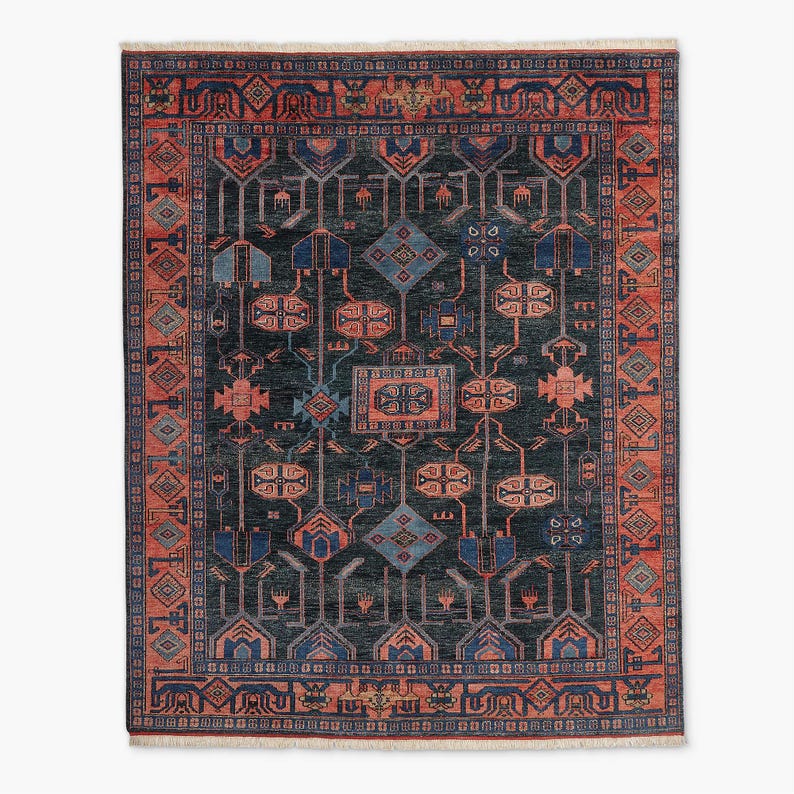 Decorative hand knotted oushak rug with intricate patterns on a white background